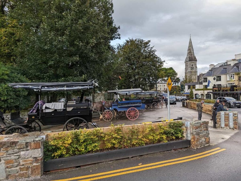 horse-drawn jaunting cars lined up in Killarney, Ireland